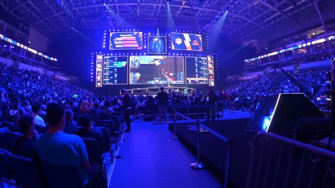 MOSCOW, RUSSIA - 14th SEPTEMBER 2019: esports Counter-Strike: Global Offensive event. Overview stabilized shot of arena, player's booths, big screens and tribunes.