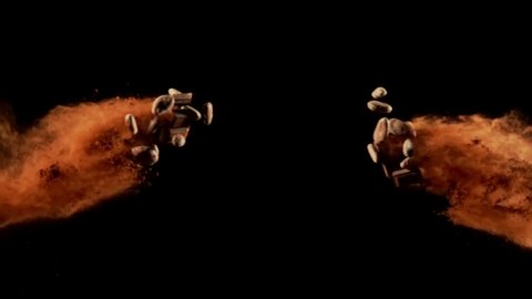 Chocolate Cacao and Cacao beans collide on black background closeup in super slow motion