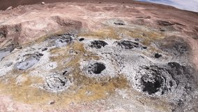 Tourist walks on the land with mud wells and steam vents located in the geothermal area named Sol de Manana (Morning Sun) in Bolivia. - Powered by Shutterstock - Get 15% off with code: PIKWIZARD15