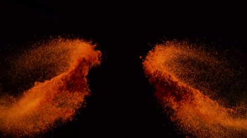 Exotic Spices paprika  collide on black background closeup in super slow motion