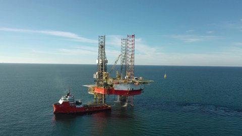 SARAWAK, MALAYSIA - OCTOBER 6, 2019: Standby vessel with Velesto naga 7 offshore jack-up drilling rig in Malaysian Waters.