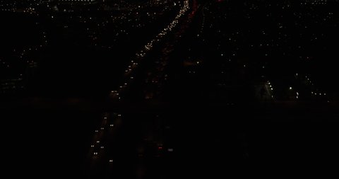 Aerial shot, night, follow traffic on Los Angeles highway, drone