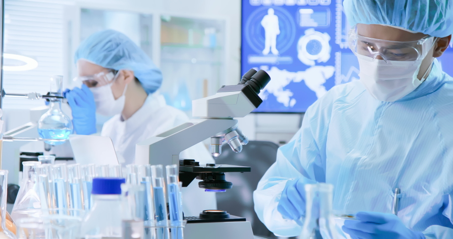 asian biotechnology scientist team has researching in the laboratory Royalty-Free Stock Footage #1038534620
