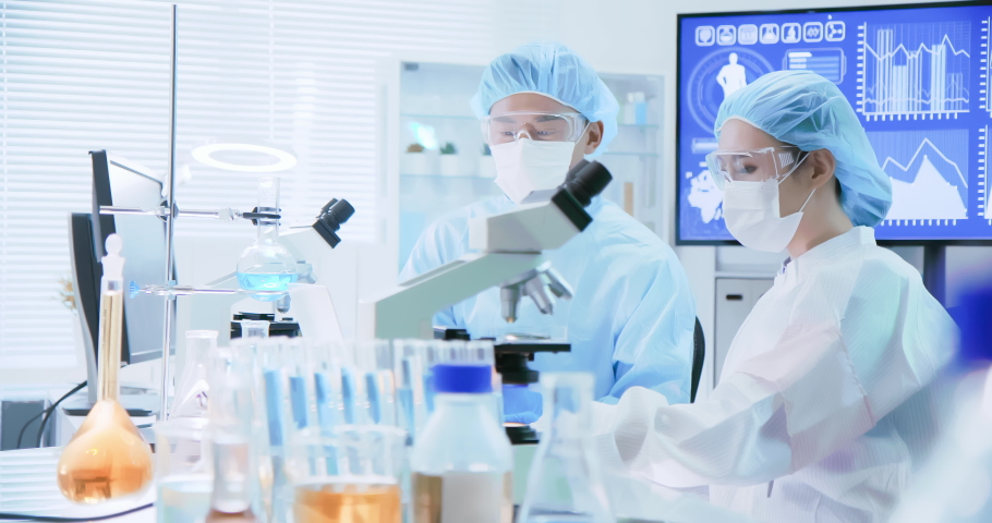 Asian scientist team discuss research in the laboratory | Shutterstock HD Video #1038534623
