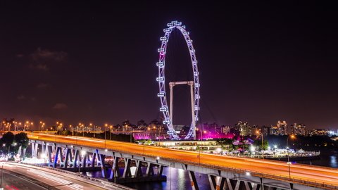 Fireworks behind Singapore Flyer time lapse at night