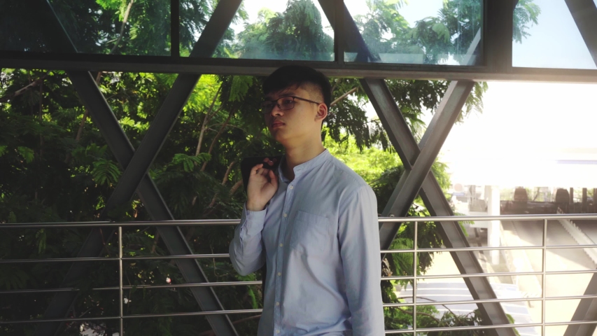 Male university students rushed into the classroom in the morning, hurried to attend school before teaching