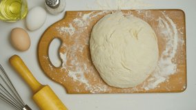 Video of girl kneading dough in the kitchen