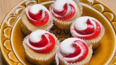 Serving strawberry swirl shortcake cupcakes