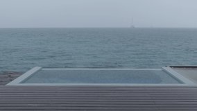 Rain on Vacation - video of luxury pool while raining and bad weather on holidays getaway travel.