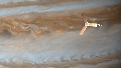 Juno's satellite flying in the orbit of Jupiter. A spinning satellite flies against the background of the planet under bright sunlight. NASA satellite. Scientific Space 4K Video Footage