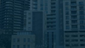 Animation of blue to green graph on a screen with cityscape in the background - Powered by Shutterstock - Get 15% off with code: PIKWIZARD15