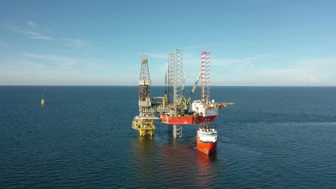 SARAWAK, MALAYSIA - OCTOBER 6, 2019: Standby vessel with Velesto Naga 7 offshore jack-up drilling rig and oil production platform in Malaysian Waters.