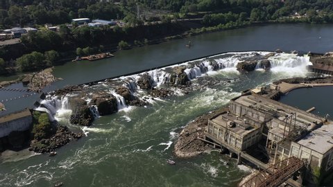 willamette falls aerial orbit over river and industrial area