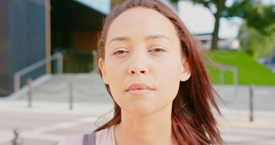 A beatiful young lady posing outdoors