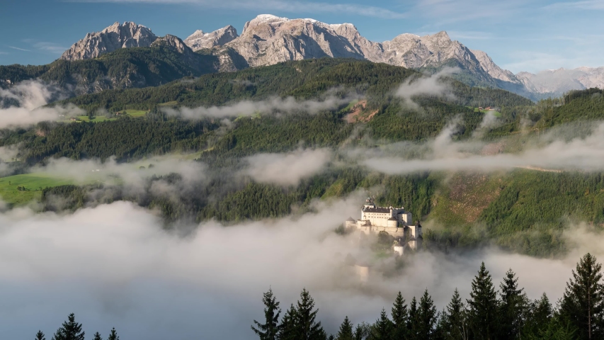 Hohenwerfen Castle in Austria. Foggy morning in Autumn Season. 4k Time Lapse. 