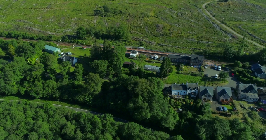 Aerial straight down over Dalmally railway station in Argyll in the Scottish Highlands