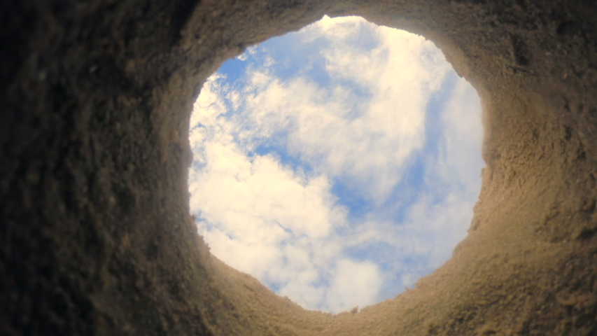 Burying the deep hole with blue sky.