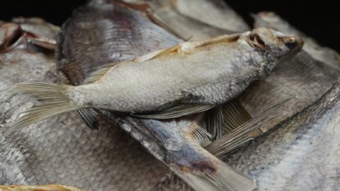 Freshwater dry fish, sun-dried bream and roach, background