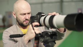 A photographer (cameraman) shoots for fencing competitions. Slow motion. Kyiv