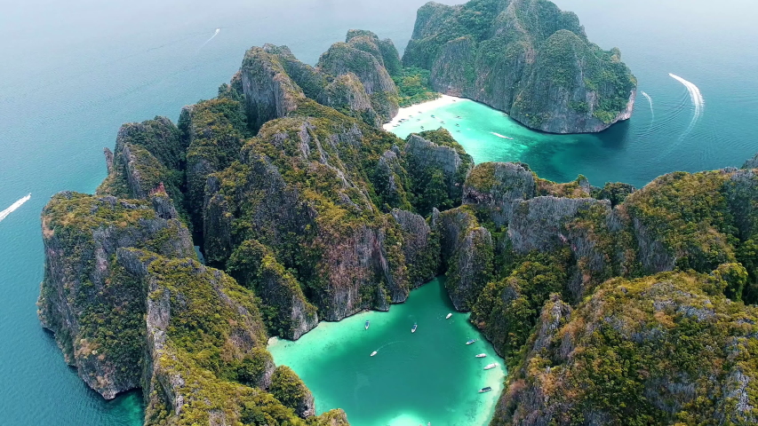 Aerial view of iconic tropical turquoise water Pileh Lagoon surrounded by limestone cliffs, Phi Phi islands, Thailand | Shutterstock HD Video #1038620825