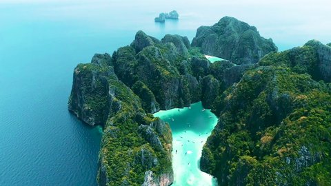 Aerial view of iconic tropical turquoise water Pileh Lagoon surrounded by limestone cliffs, Phi Phi islands, Thailand