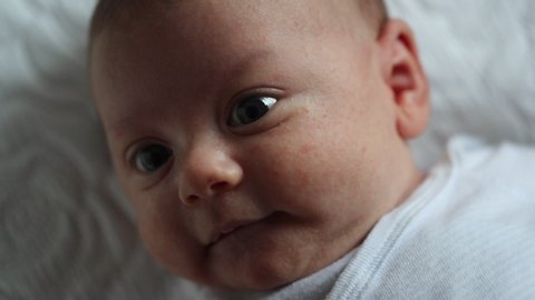 Spontaneous happy baby emotion infant face feeling joy