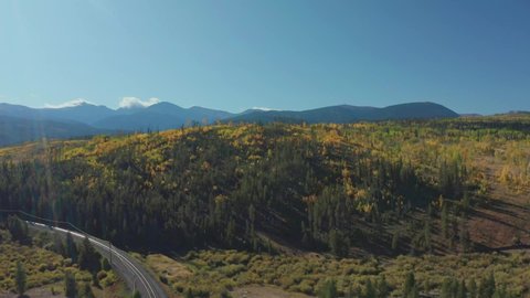 Early morning aerial footage in Shadow Mountain Lake in Grand Lake Colorado with the fall colors just beginning
