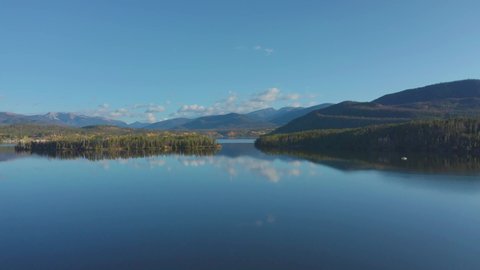 Early morning aerial footage in Shadow Mountain Lake in Grand Lake Colorado with the fall colors just beginning