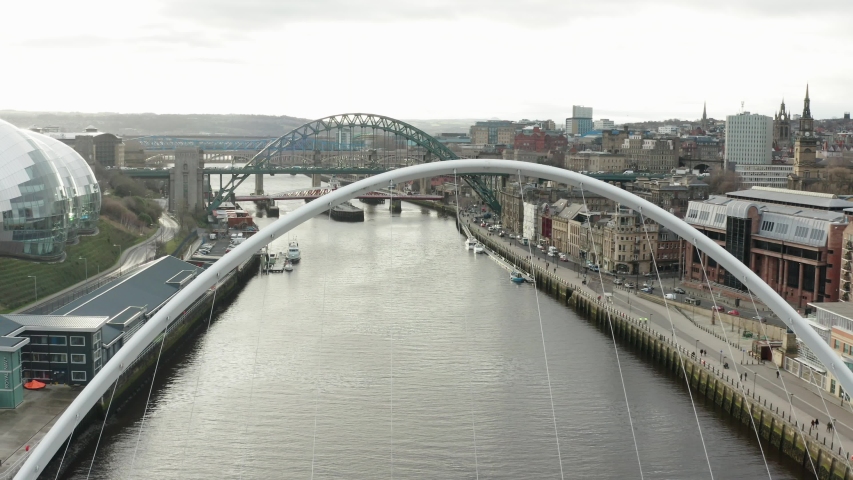 A flight along the river Tyne showing the bridges and Newcastle city Centre Royalty-Free Stock Footage #1038637298