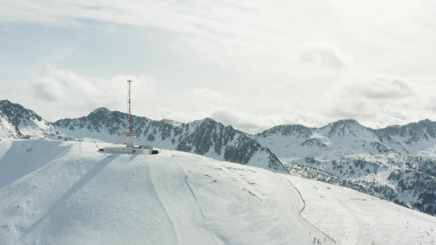 A rotation around a ski building at the top of a mountain