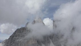 Mountain View Aerial 4K Footage with Clouds Flying in Dolomites. Italy Dolomites 4k Footage Flat Profile Ready For Grading. 