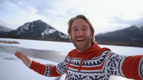 Man takes cool selfie shot near frozen lake during winter season