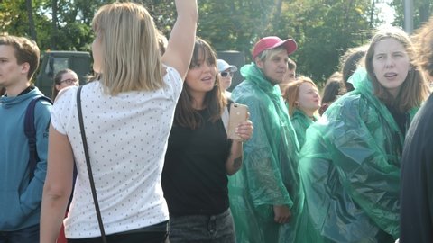 KHARKIV, UKRAINE - September 15, 2019:  Group of girls celebrating pride day with LGBT flag