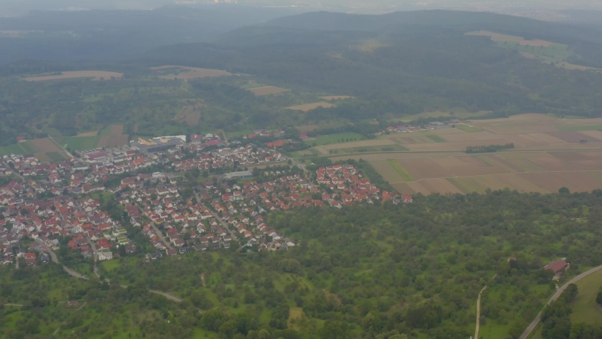 Aerial View of the village Owen in Germnay on an early morning with clouds. Zoom in on the village from far above.