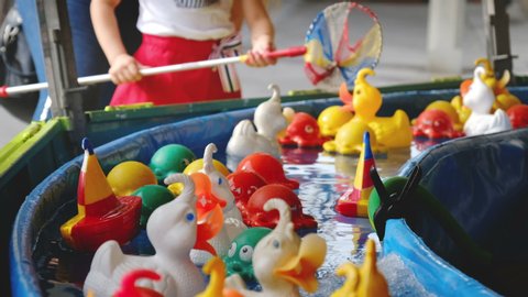 fairground classic game of rubber ducks hook fishing