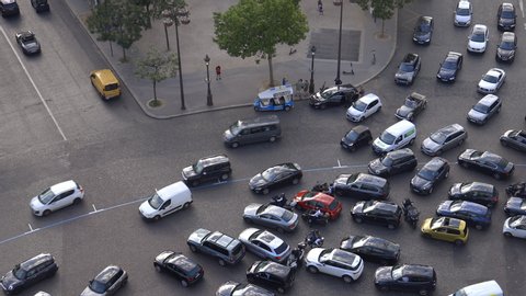 Paris, France - July 2019 : Cars stuck in traffic jam on the Place de l'Etoile near Arc de Triomphe in Paris
