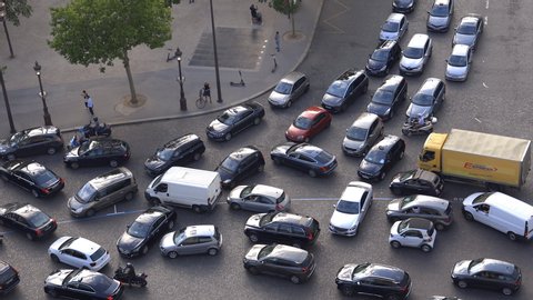Paris, France - July 2019 : Cars stuck in traffic jam on the Place de l'Etoile near Arc de Triomphe in Paris