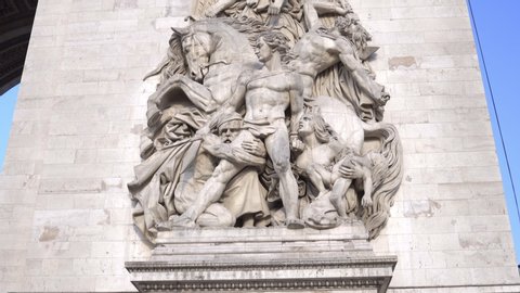 Paris, France - June 2019 : Arc de Triomphe in Paris France, sculpture on the facade of the arch standing at the end of Champs-Elysees Avenue at the center of Place Charles de Gaulle Square
