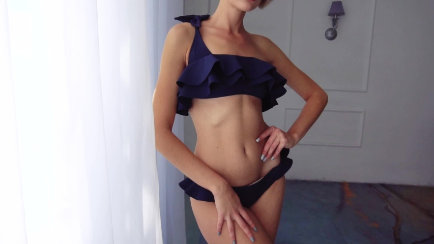 Blonde girl in a swimsuit