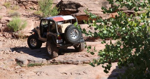 Moab, Utah, USA,September , 12,2019 :Footage of a Black Rubicon Jeep Wrangler on Kane Creek Canyon off road 4x4 Jeep trail.