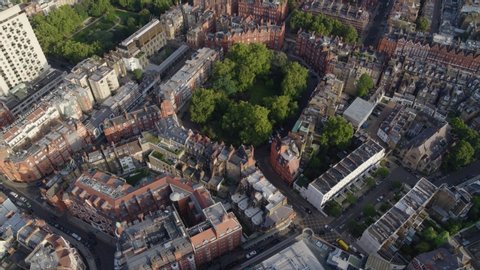 Aerial establishing shot of garden squares in Prime Central London, featuring the royal borough of South Kensington
