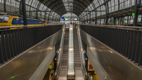 Amsterdam / Netherlands - October 4th 2019: Timelapse of people arriving with train to Amsterdam Central Station
