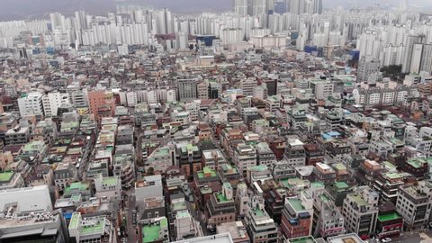 Daechi-dong residential area of Gangnam, aerial shot. Low-rise house buildings, expensive real estate at central district of Seoul city. Camera fly forward and tilt down