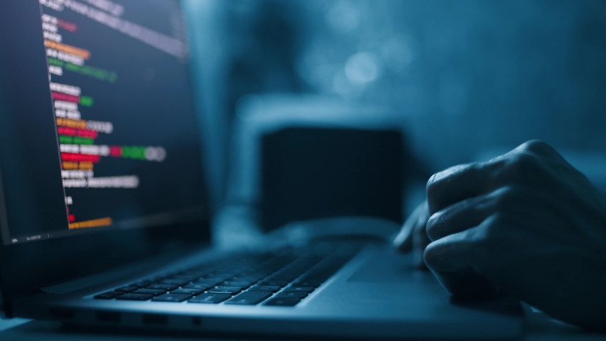 Close up hand of developing programming and coding technologies. Programmer hand typing on keyboard. Put on the wood table at night. Programmer concepts.