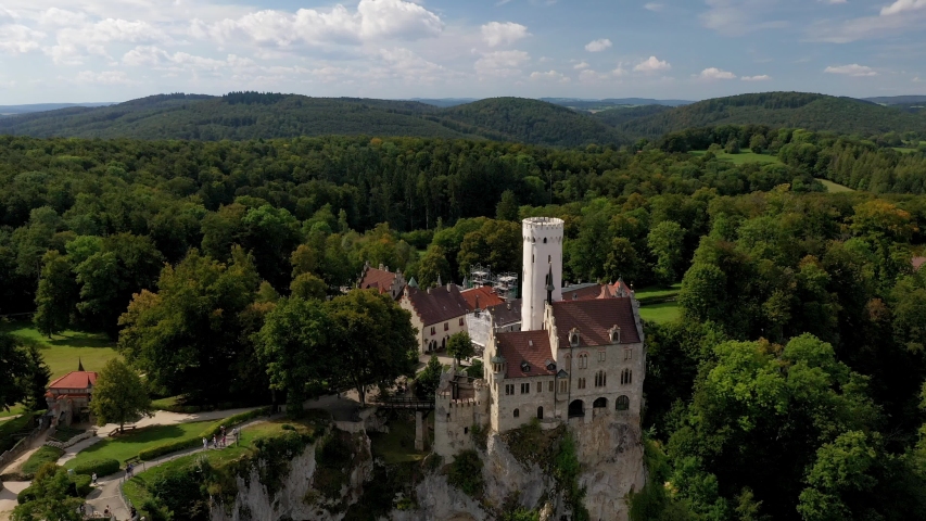 Tilt down aerial shot of the Lichtenstein Castle in Germany.