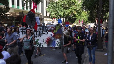 BRISBANE, AUSTRALIA - 20th September 2019 -  Strike for Climate protestors march in numbers up George St in Brisbane CBD in orderly and colourful fashion.