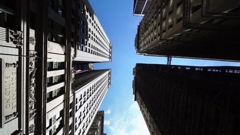 Moving looking up pov drone shot of NYC New York City Manhattan modern skyscraper high-rises. Concept of financial center, modern business city, historic iconic travel destination in USA.