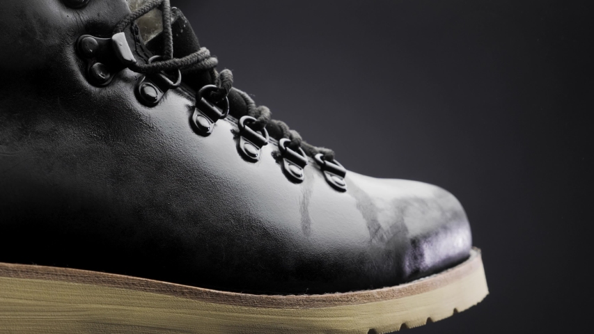 A waterproof spray is applied to the shoes