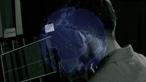 Business man with global reach checks market trends as he works to reach his target goals, working at late night with earth spin overlay - Powered by Shutterstock - Get 15% off with code: PIKWIZARD15