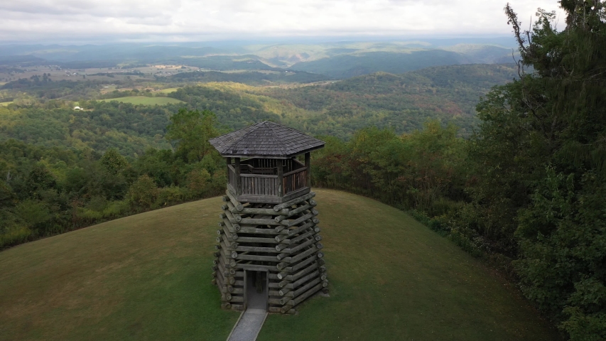 Closeup aerial orbit low and to the right showing the overlook tower at Droop Mountain State Park in West Virginia.
